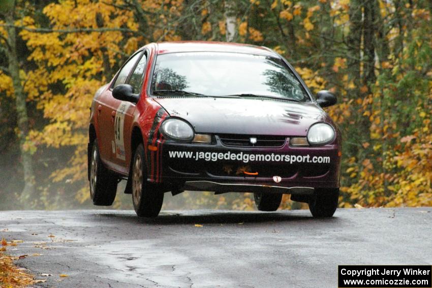 Sans Thompson / Craig Marr Dodge Neon ACR catch minor air at the midpoint jump on Brockway, SS10.