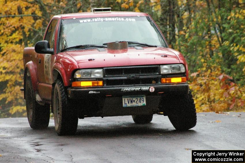 Jim Cox / Ryan LaMothe Chevrolet S-10 takes it easy over the midpoint jump on Brockway, SS10, due to suspension failure.