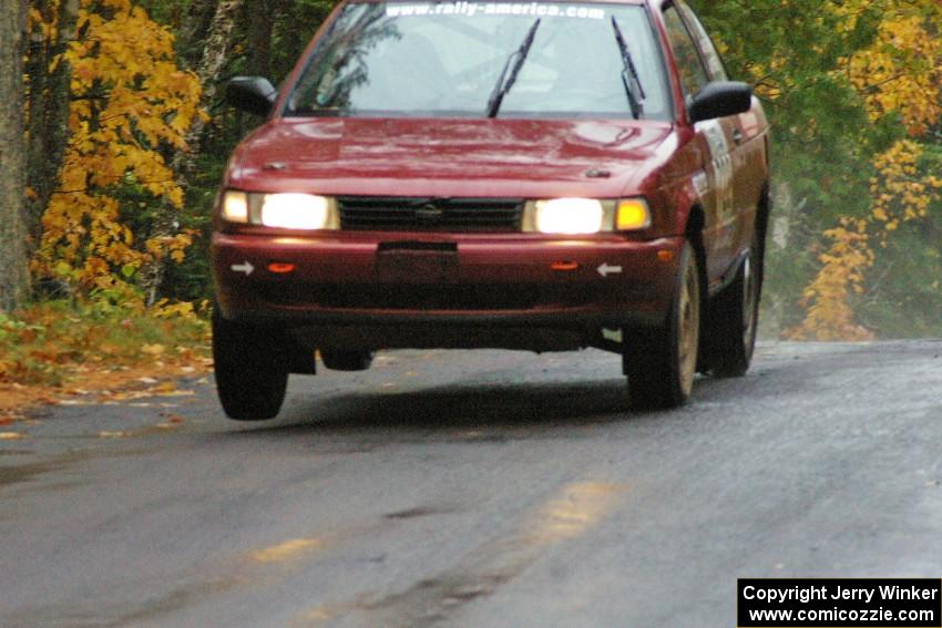 Rob Stroik/ Ross Wegge Nissan Sentra SE-R lifts the right side slightly at the midpoint jump on Brockway, SS10.