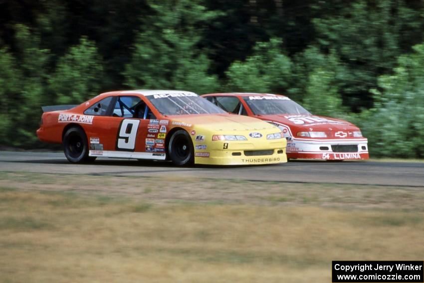 Dennis Lampman's Ford Thunderbird gets the inside line on Steve Shive's Chevy Lumina at turn 3.