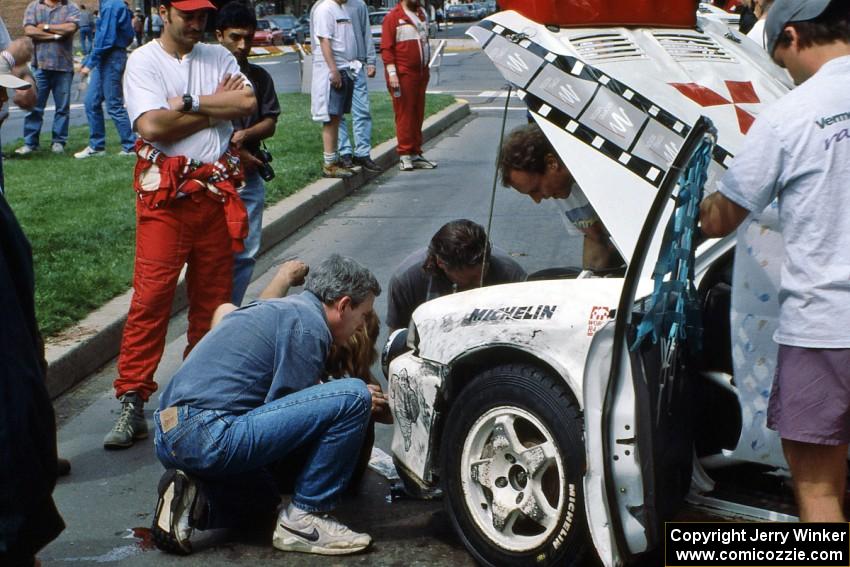 The Henry Joy IV / Michael Fennell Mitsubishi Lancer Evo II gets repaired after rolling early in the day