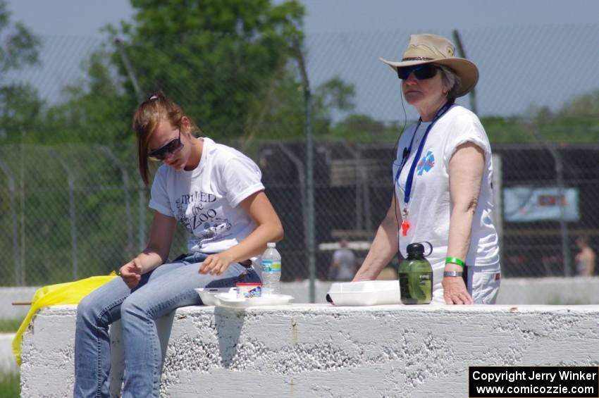 Corner workers at turn 6 take a lunch during the race.