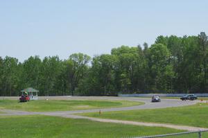 Holy Rollers Acura Integra passes the stalled Team HACKcent Hyundai Accent at the carousel