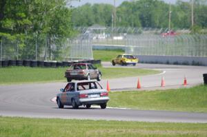 Ambitious But Rubbish Buick Regal ahead of the Speedlab BMW 325e and North Loop Motorsports BMW 325