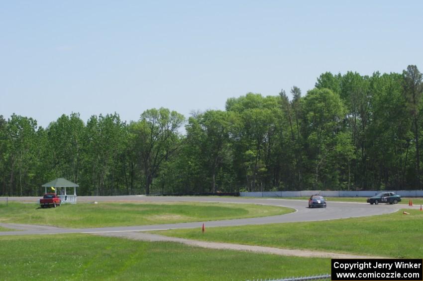 Holy Rollers Acura Integra passes the stalled Team HACKcent Hyundai Accent at the carousel