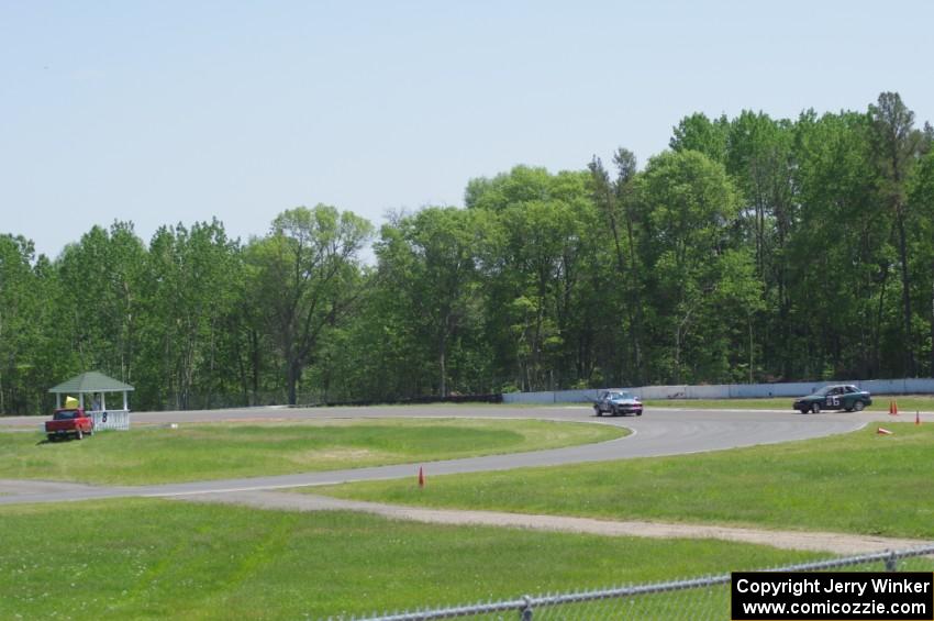 Chump Faces BMW 325is passes the stalled Team HACKcent Hyundai Accent at the carousel