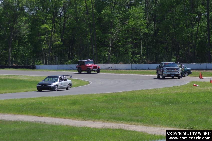 Three Sheets Ford Contour passes by as Team HACKcent Hyundai Accent gets a pull to re-start