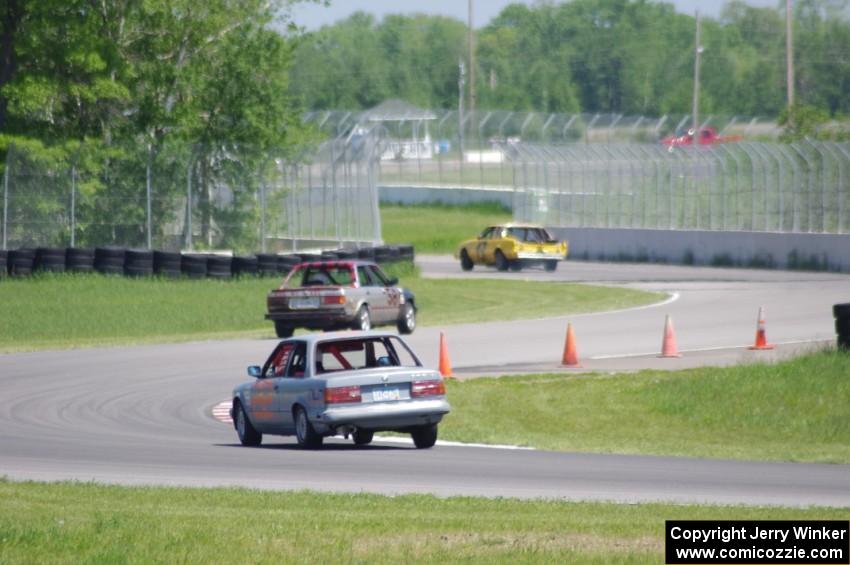 Ambitious But Rubbish Buick Regal ahead of the Speedlab BMW 325e and North Loop Motorsports BMW 325