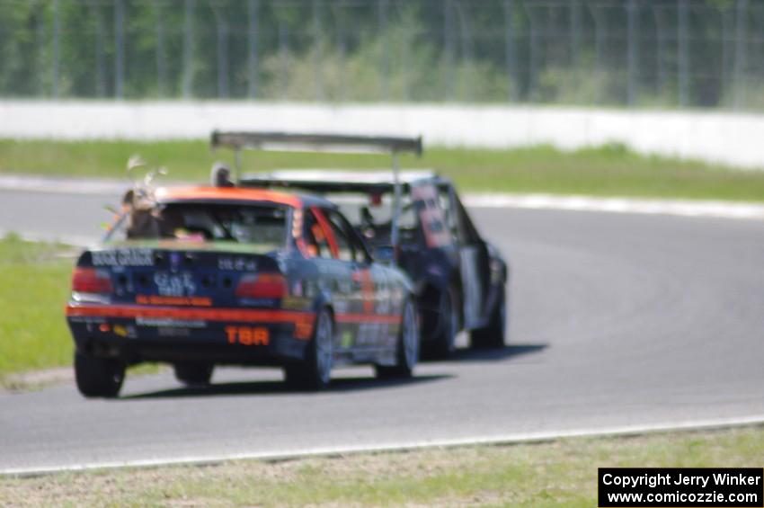 Brake Dusters BMW 540 leads Tubby Butterman BMW 325 through turn 6