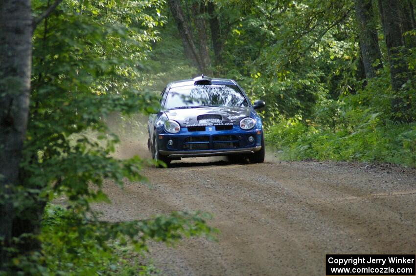 Cary Kendall / Scott Friberg blast down a straight on SS2 in their Dodge SRT-4.