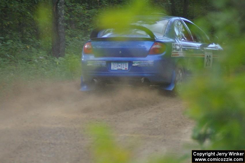 Cary Kendall / Scott Friberg power out of a left-hander on SS2 in their Dodge SRT-4.