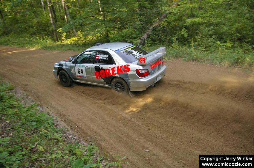 Robert Borowicz / Mariusz Borowicz drift through a fast left-hander on SS2 in their Subaru WRX STi.