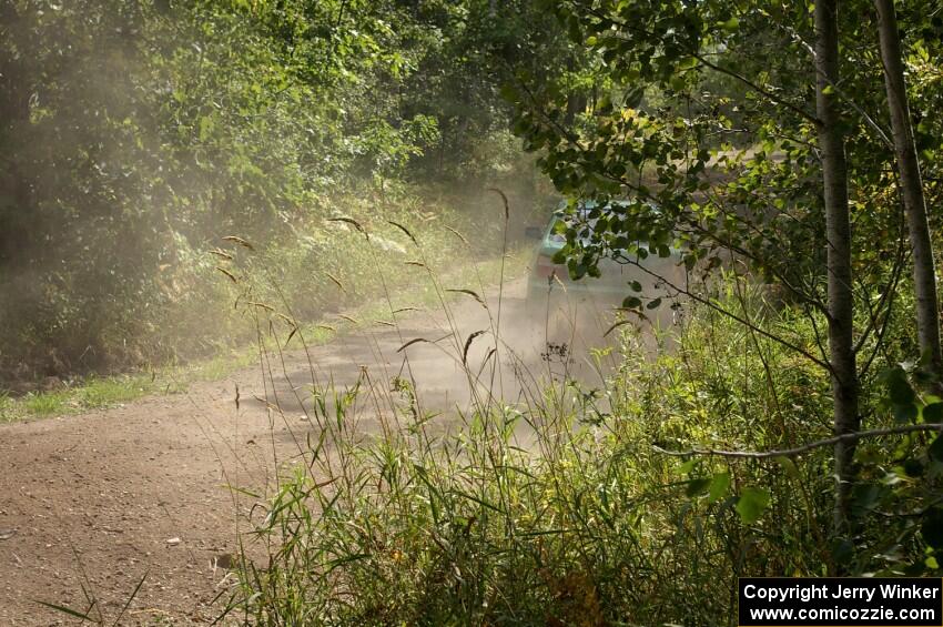 Eric Langbein / Jeremy Wimpey power out of a corner on SS9 in their Subaru WRX.