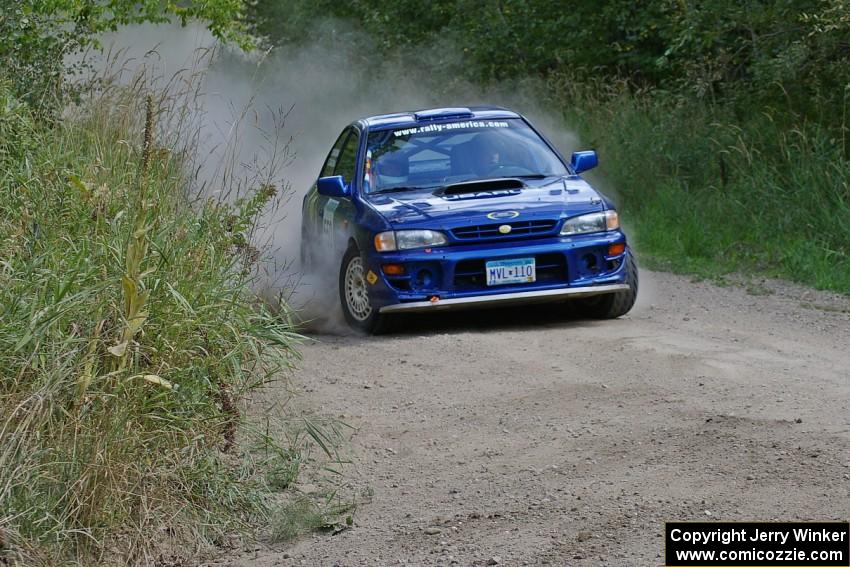 Kyle Sarasin / Stuart Sarasin set up for a 90-left on SS9 in their Subaru Impreza.