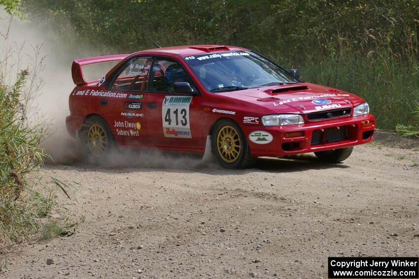 Erik Schmidt / Mike Rose set up for a hard-left on SS9 in their Subaru Impreza.