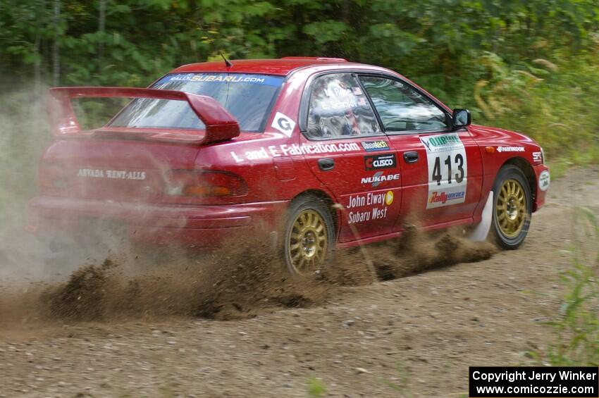 Erik Schmidt / Mike Rose drift beautifully after a hard-left on SS9 in their Subaru Impreza.