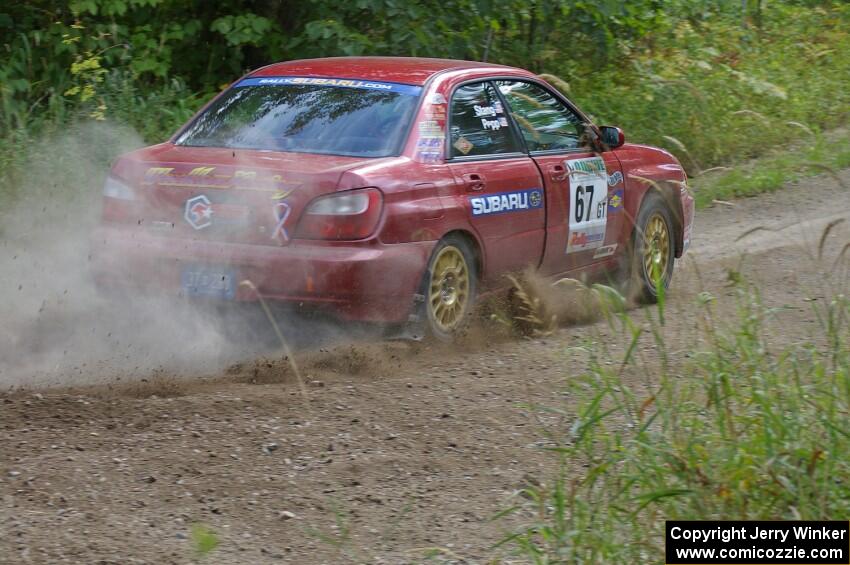 Bryan Pepp / Jerry Stang power out of a 90-left on SS9 in their Subaru WRX.