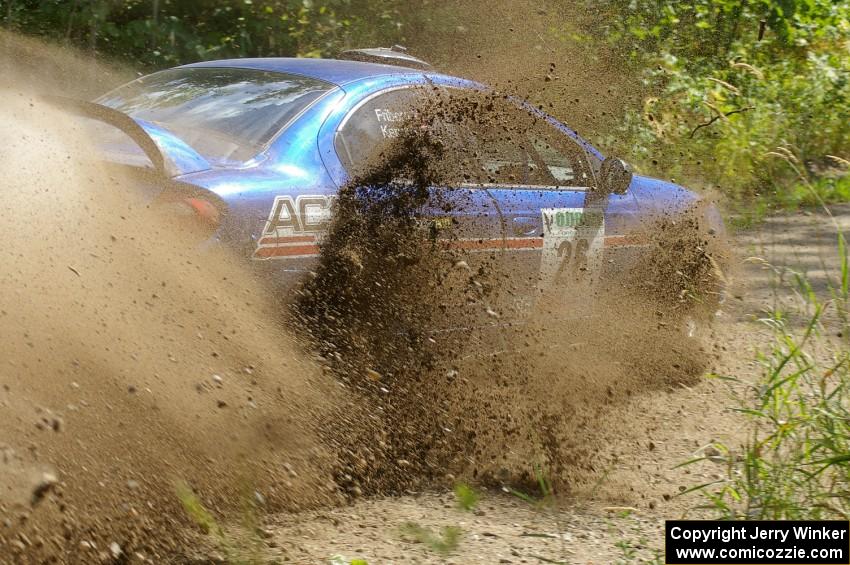 Cary Kendall / Scott Friberg Dodge SRT-4 slings gravel everywhere at a 90-left on SS9.