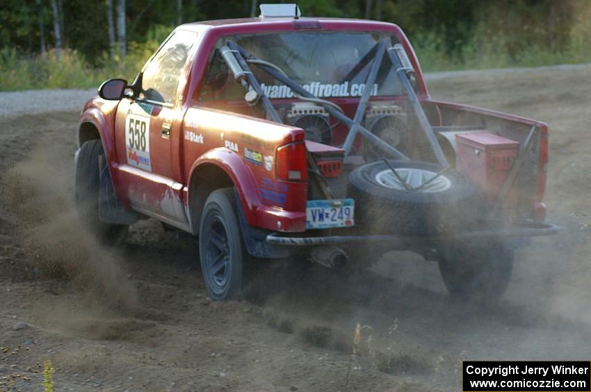 Jim Cox / Chris Stark enter onto the county road at the spectator point on SS14 in their Chevy S-10.