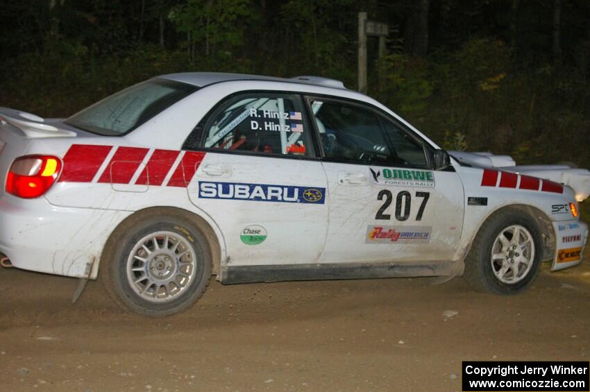 Dave Hintz / Rick Hintz at a 90-left on SS16 in their Subaru WRX.