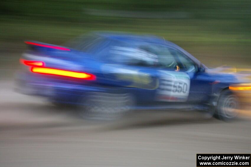 Kyle Sarasin / Stuart Sarasin at speed at dusk in their Subaru Impreza 2.5RS on SS16.