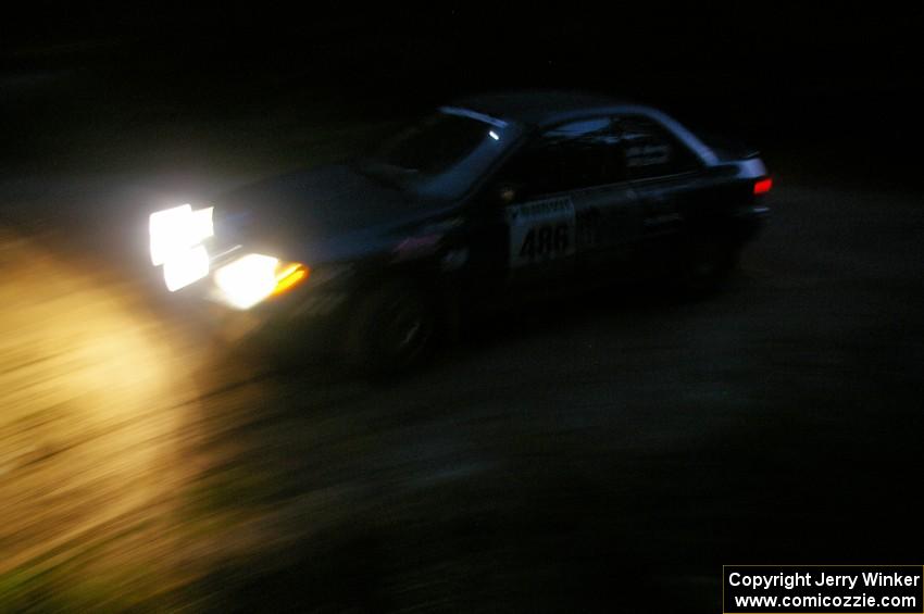 Martin Menning / Ryan Schnell through a 90-left on SS16 in their Subaru Impreza.