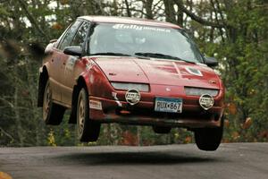 Jonah Liubakka / Craig Walli catch really nice air in their Saturn SL-2 at the midpoint jump on Brockway 1, SS11.