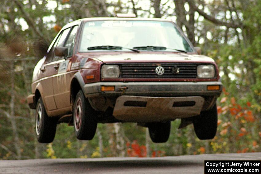 Matt Bushore / Andy Bushore catch nice air at the midpoint jump on Brockway 1, SS11, in their VW Jetta.