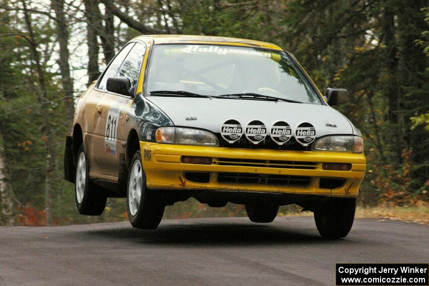 Jaroslaw Sozanski / Kazimierz Pudelek catch a little air at the midpoint jump on Brockway 1, SS11, in their Subaru Impreza.