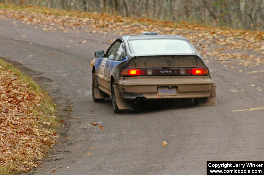 Chris Gordon / Matt Pekuri blast uphill after a hard landing at the midpoint jump on Brockway 1, SS11, in their Honda CRX.