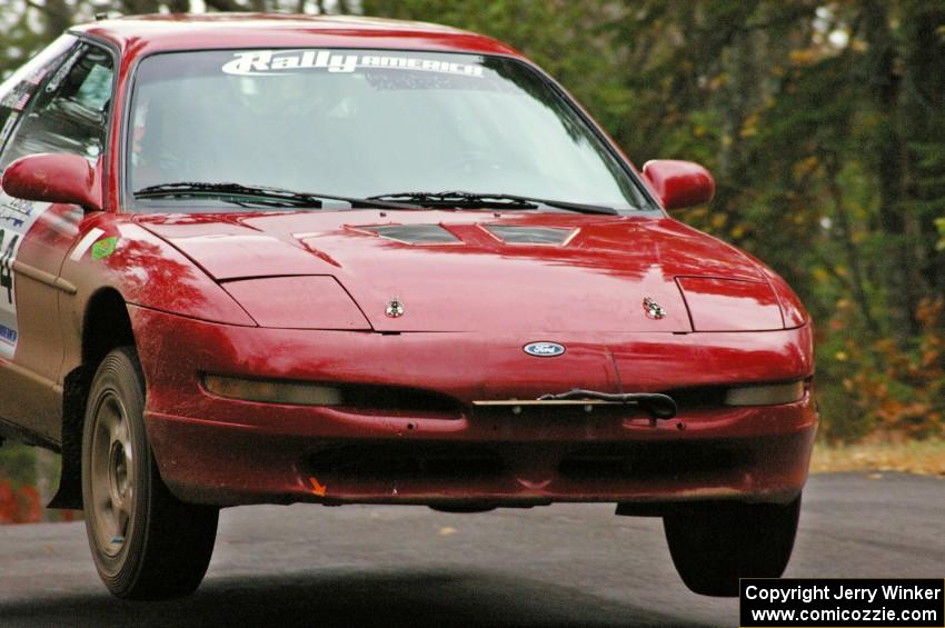 Tom Diehl / Mike Rodriquez catch decent air over the midpoint jump on Brockway 1, SS11, in their Ford Probe GT.