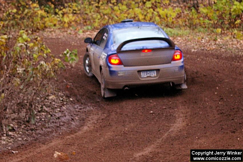 Cary Kendall / Scott Friberg drift through the first corner of SS15, Gratiot Lake 2, in their Dodge SRT-4.